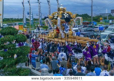 Himeji, Japan - October 14, 2019: Portable Shrine Lifted By Men In Traditional Dressing, And Crowd. 