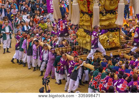 Niihama, Japan - October 17, 2019: Men In Traditional Clothing Carrying A Taikodai Drum Float, As Pa