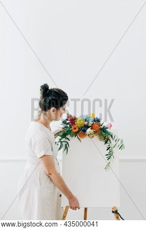 Woman with a floral greeting canvas frame