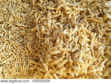 Farsan or Namkeen- a popular Indian salty savory. Close up shot of Sev farsan mixture feom a traditional sweet shop in India.