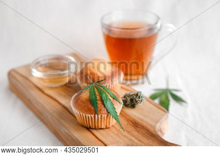 Delicious Homemade Muffin With Cbd Cannabis And Leaf Garnish. Medicinal Edibles. Treatment Of Medica