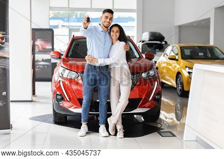 Happpy Beautiful Muslim Family Buying New Car In Salon