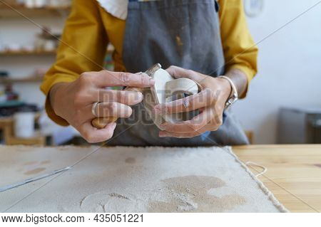 Working With Raw Clay: Caucasian Female Ceramic Studio Owner Shaping And Modeling Material For Prepa
