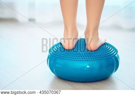 The Child Stands On A Special Inflatable Pillow For The Prevention And Treatment Of Hallux Valgus At