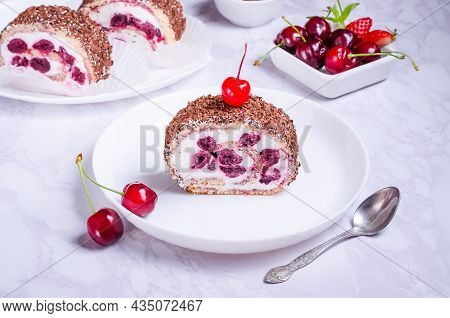 Cream Cake With Cherries On A White Plate On A Marble Background