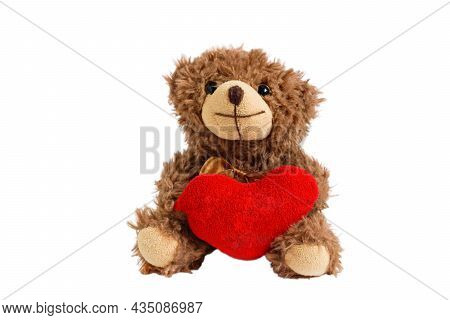 Teddy Bear Heart Isolated. Fluffy Stuffed Toy On A White Background Close-up. Teddy Bear With A Red 