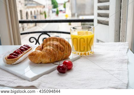 French Breakfast, Fresh Baked Croissant Buttery Pastry Served With Orange Juice And Old French House