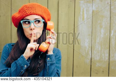 Secretive Woman Gossiping On The Phone With A Friend