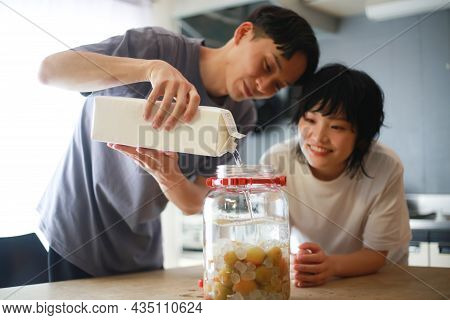 Image Of A Couple Making Plum Wine