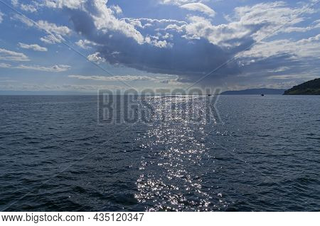 Beautiful Clouds Over Lake Baikal, Russia. Sunny Day In August.
