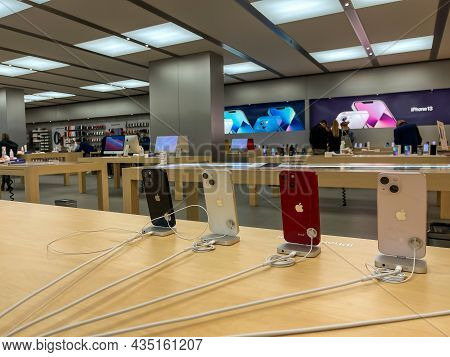 Cologne, Germany - October 01st 2021: A German Photographer Comparing And Testing The New Iphone 13 