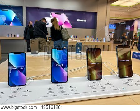 Cologne, Germany - October 01st 2021: A German Photographer Comparing And Testing The New Iphone 13 
