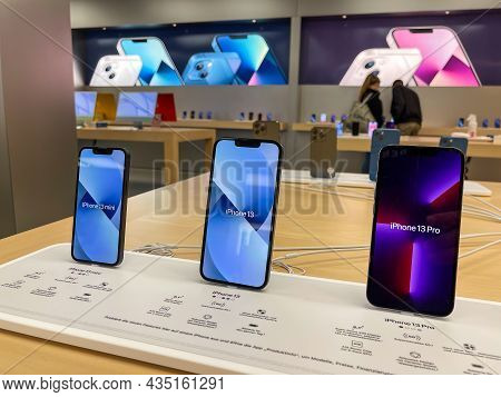 Cologne, Germany - October 01st 2021: A German Photographer Comparing And Testing The New Iphone 13 