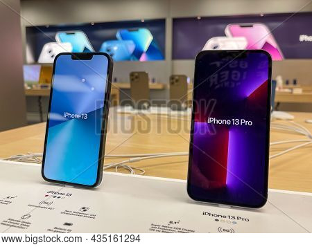 Cologne, Germany - October 01st 2021: A German Photographer Comparing And Testing The New Iphone 13 