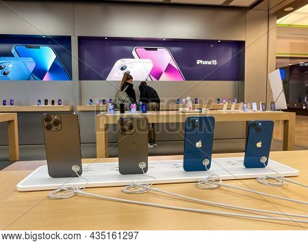 Cologne, Germany - October 01st 2021: A German Photographer Comparing And Testing The New Iphone 13 