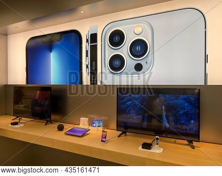 Cologne, Germany - October 01st 2021: A German Photographer Comparing And Testing The New Iphone 13 