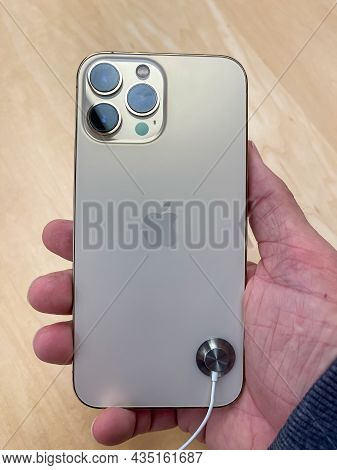 Cologne, Germany - October 01st 2021: A German Photographer Comparing And Testing The New Iphone 13 