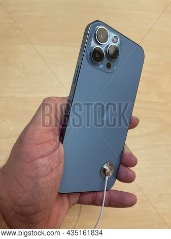 Cologne, Germany - October 01st 2021: A German Photographer Comparing And Testing The New Iphone 13 