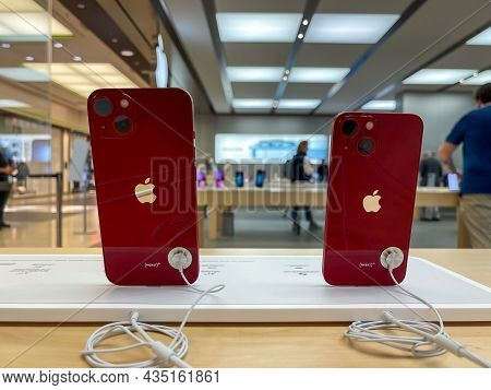 Cologne, Germany - October 01st 2021: A German Photographer Comparing And Testing The New Iphone 13 