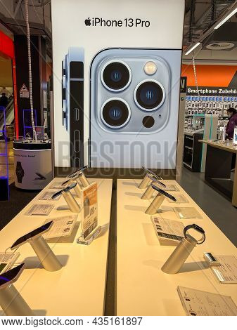 Frankfurt, Germany - October 04th 2021: A German Photographer Comparing And Testing The New Iphone 1