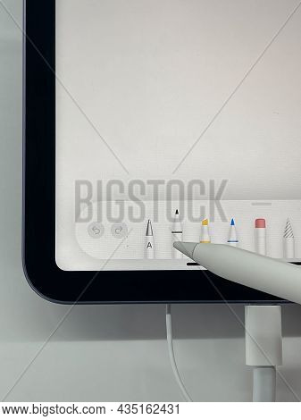 Frankfurt, Germany - October 04th 2021: A German Photographer Visiting A Saturn Market, Comparing Th