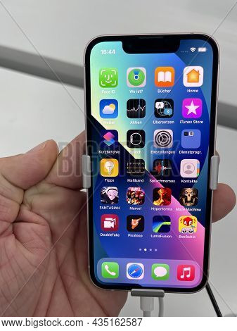 Frankfurt, Germany - October 04th 2021: A German Photographer Comparing And Testing The New Iphone 1