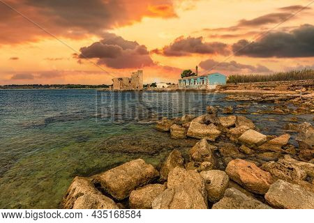 Tonnara in Vendicari at sunset in Sicily.