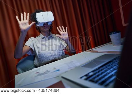 Worker Having Break At Workplace With Vr