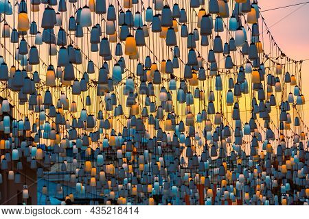 Street Lights On Stoleshnikov Lane. Moscow Pedestrian Street. Lights In The Sunset. Beautiful Backli