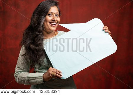 Beautiful Happy Smiling Young Indian Girl With Empty Sign Board - Concept Of Announcement Of Promoti