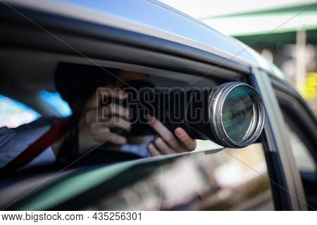 A Man Taking A Picture From Inside The Car