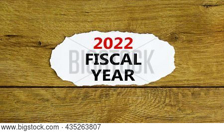 2022 Fiscal New Year Symbol. Words '2022 Fiscal Year', On White Paper. Beautiful Wooden Background. 
