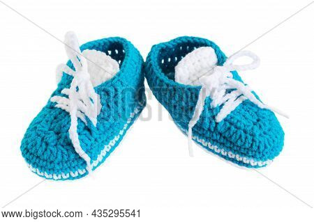 Knitted Booties Isolated. Blue Handmade Small Shoes For A Newborn Boy On A White Background. The Con