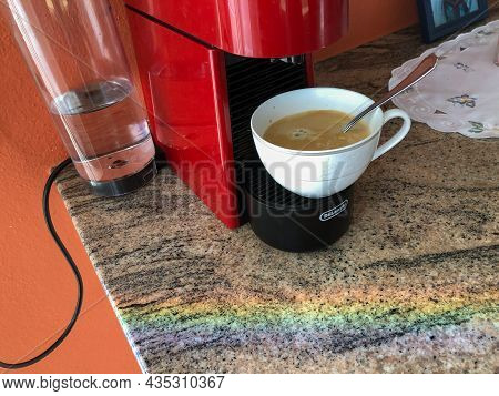 Ruggell, Liechtenstein, September 25, 2021 Fresh Brewed Coffee And A Rainbow Stripe In The Front On 