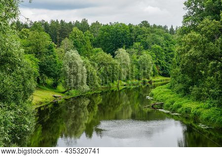 Summer Landscape With A View Of The Bend Of The River With Tree Covered Banks