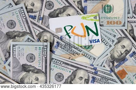 Grodno, Belarus - 07.21.2021: A Bunch Of Dollars And A Visa Card Close-up. Background Of Dollars