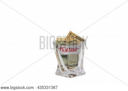 A Pile Of Dollars In A Whiskey Glass On A White Isolated Background. Retirement Savings In Dollars. 