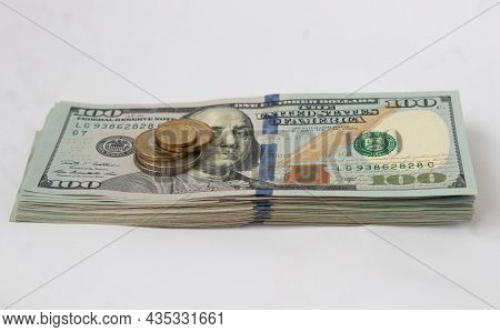 A Stack Of Hundred-dollar Bills On A White Isolated Background. 100 Dollar Bills