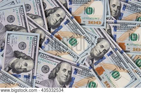 Background Of Hundred-dollar Bills. The Texture Of Hundred-dollar Bills. A Lot Of Dollars