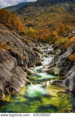 View Of The Natural Pool Of The Pilones In Hell's Throat In The Jerte Valley In Autumn