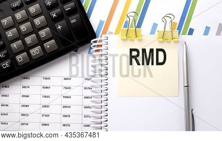 Rmd Text, Written On A Sticker With Calculator,pen On The Chart Background.