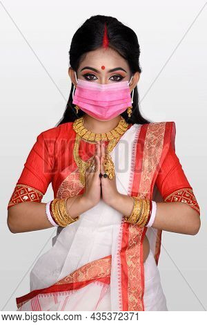 Portrait Of Pretty Young Indian Girl Wearing Traditional Indian Saree, Gold Jewellery, Bangles And M