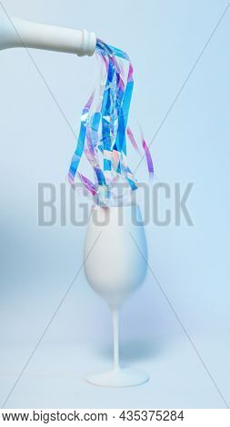 Arrangement of white gkass and wine bottle