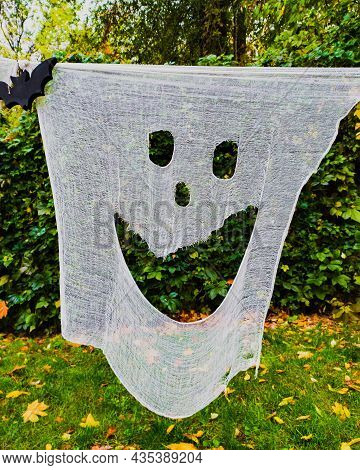 Creative Decorations For Halloween Party From White Cheesecloth In Autumn Forest
