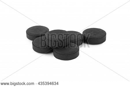 Activated Charcoal Pills On White Background. Potent Sorbent