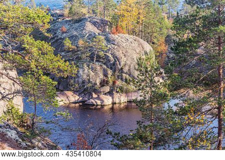 Trees On The Cliffs Of Lake Ladoga At Autumn Evening. Republic Of Karelia. Russia.