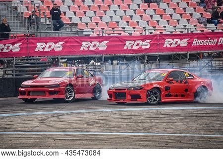Vladivostok, Russia - October 02: Two Cars Drift, Sports Cars Wheel Drifts And A Lot Of Smoke On The