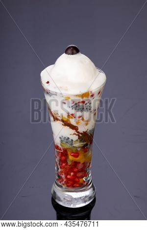 Mixed Fruit Ice Cream Or Falooda Arranged In Grey Background.