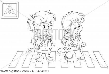 Cheerful Little Schoolboy And Schoolgirl With Backpacks Going To Their School And Crossing A Road On