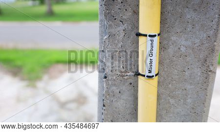 Ground Conduit On Pole-closeup. The Master Ground Conduit Of The Short Circuit Protection System Ins